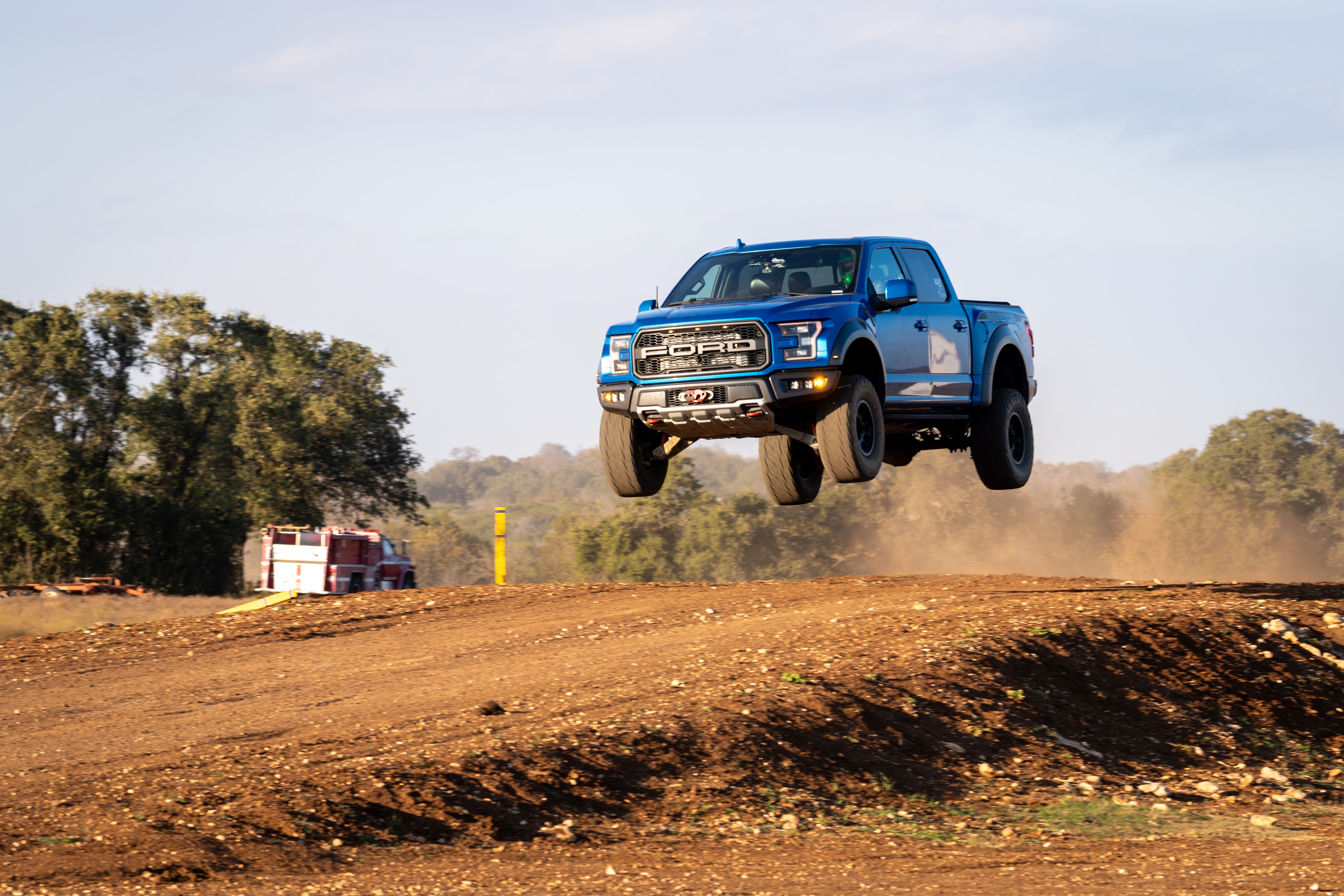 Ford Raptor big air jump — side high angle