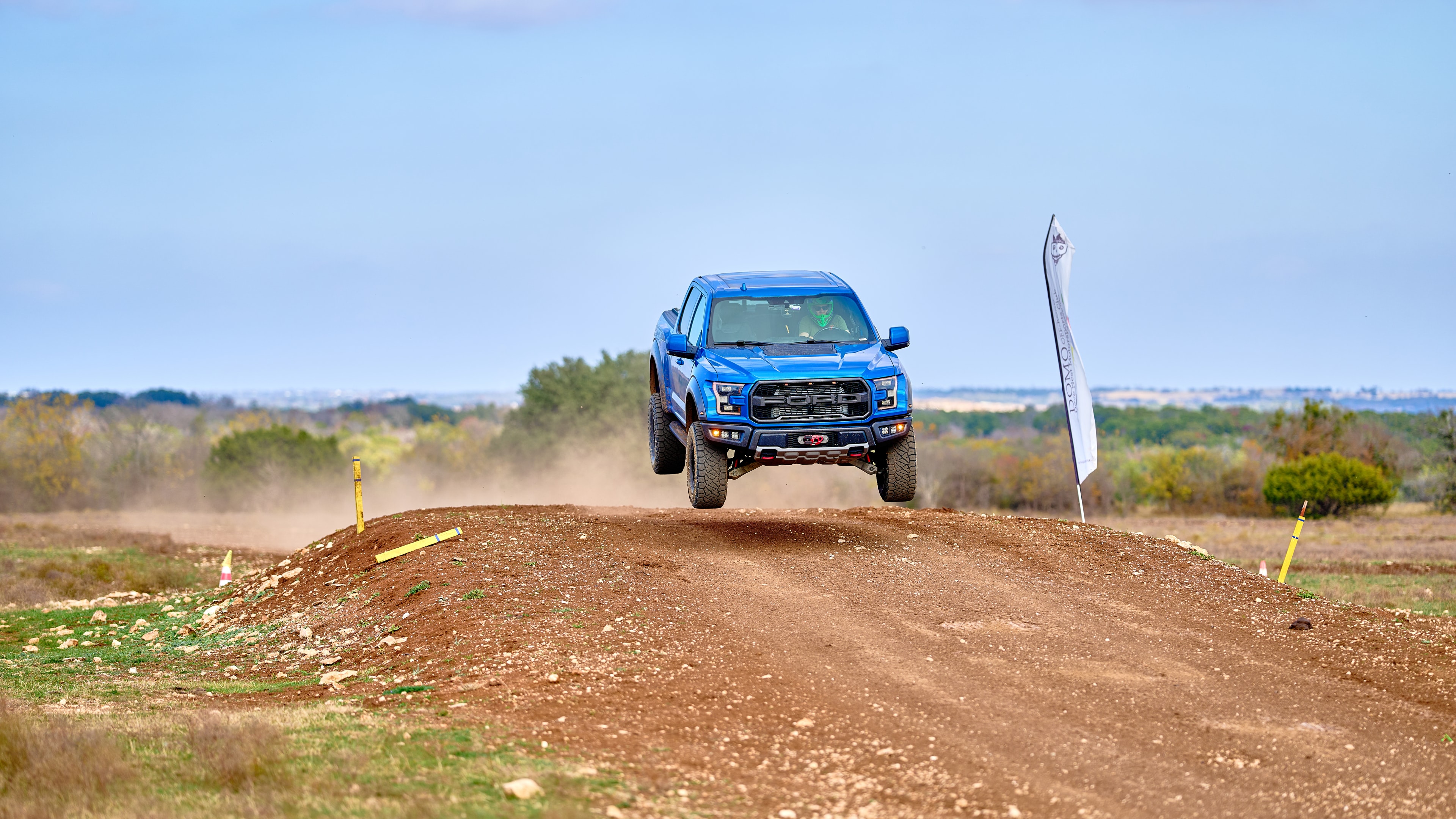 Ford Raptor airborne — distant wide shot
